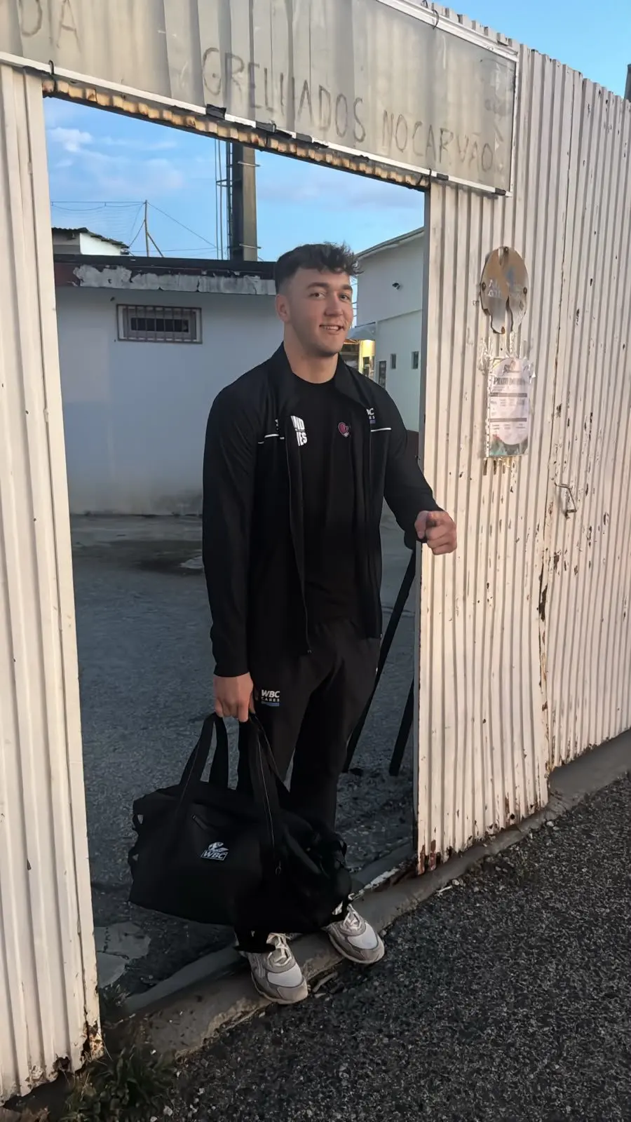 A fighter outside the gym at dawn