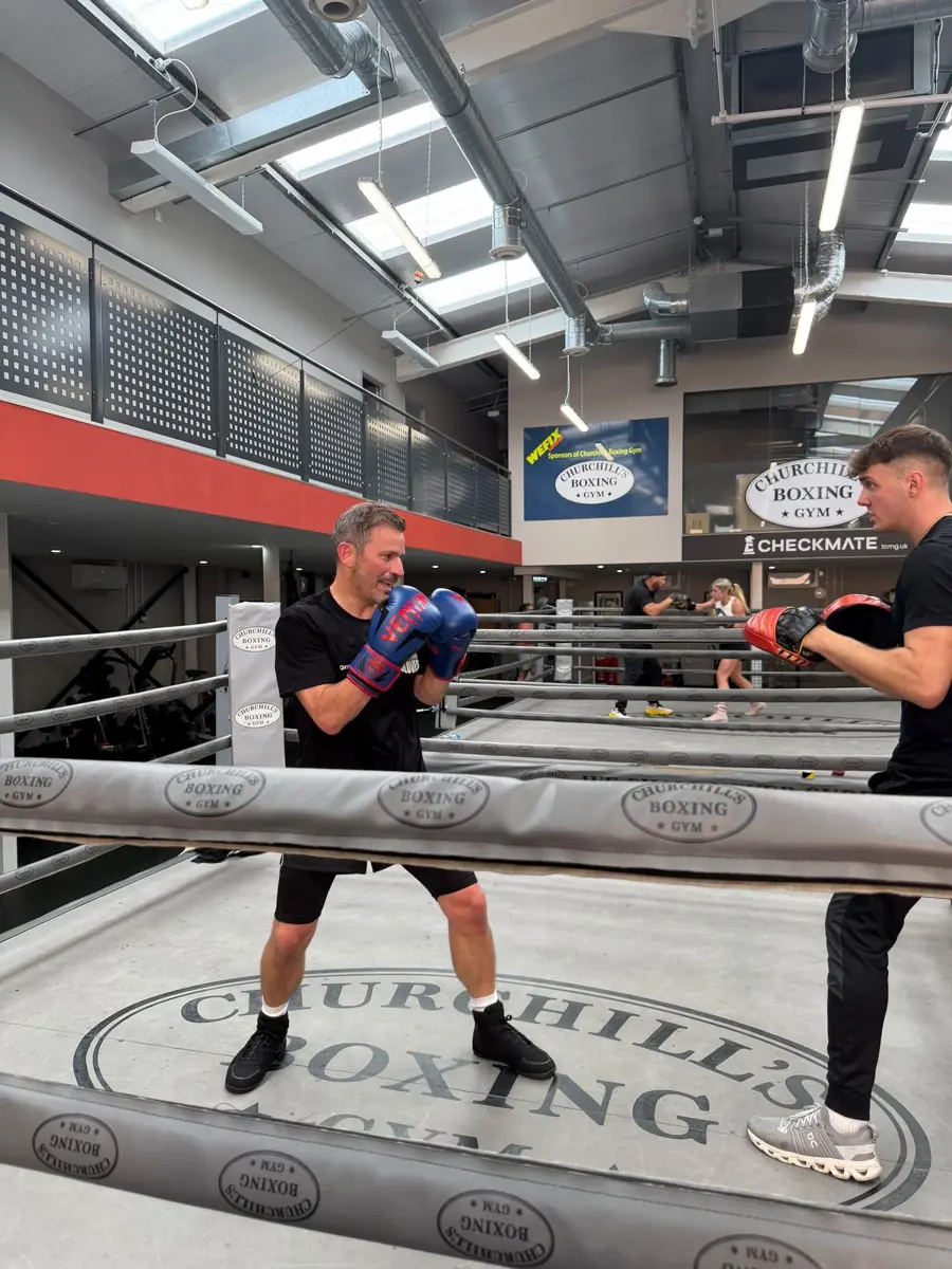 Guard up for pad work in the ring
