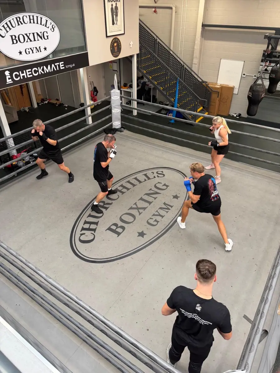 Shadow boxing in the ring, seen from the balcony
