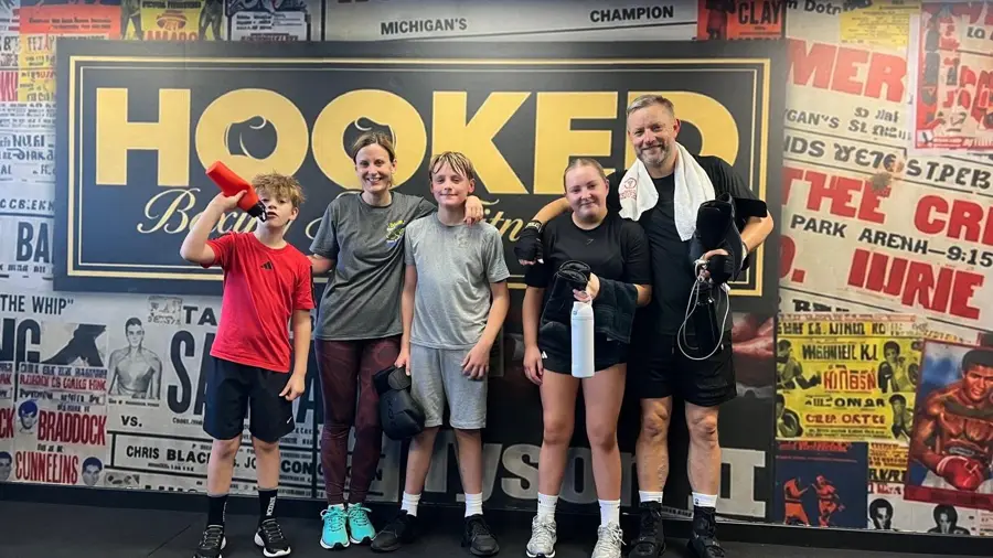 Robin Hutchison and family after a parent and child class at Hooked Boxing and Fitness